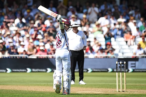 Alick Athanaze celebrates his half century